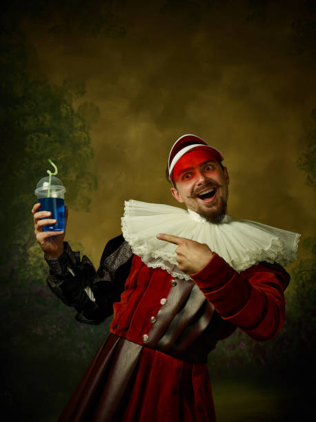 istock Young man as a medieval knight on dark background 1150907448