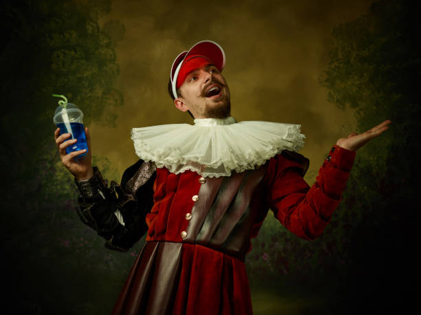 istock Young man as a medieval knight on dark background 1150907450
