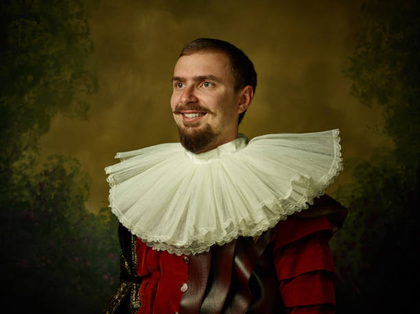 istock Young man as a medieval knight on dark background 1150907453