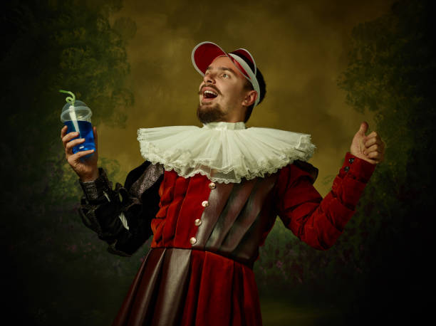 istock Young man as a medieval knight on dark background 1150907455