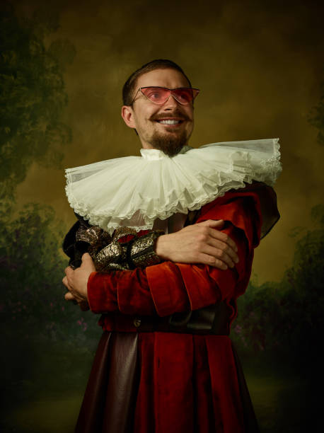 istock Young man as a medieval knight on dark background 1150907456