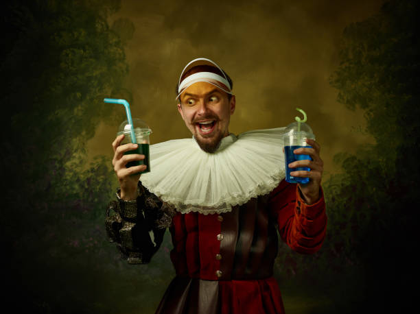 istock Young man as a medieval knight on dark background 1150907465