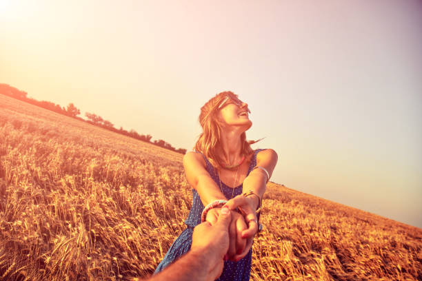 istock Young couple enjoying in a wheat field. 1150908629