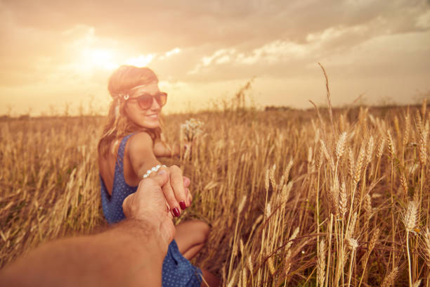 istock Young couple enjoying in a wheat field. 1150908740