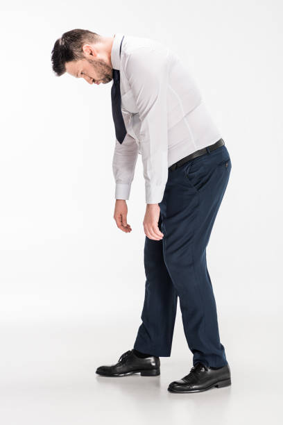 istock overweight man in tight formal wear bending over on white 1150909995