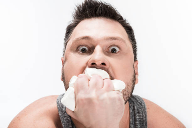 immaturity concept - adult man with dummy in the mouth