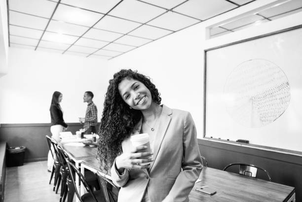 istock Hispanic businesswoman smiling during a coffee break 1150911521