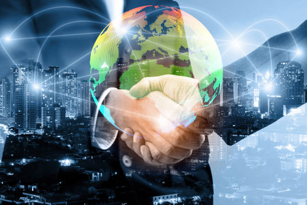 istock double exposure of businessmen handshake and global simulation connecting technology with blur city night and network connection, successful and partnership concept 1150912003