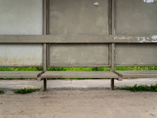 istock The old bus stop is grey. Very dusty and dirty bus stop 1150912054