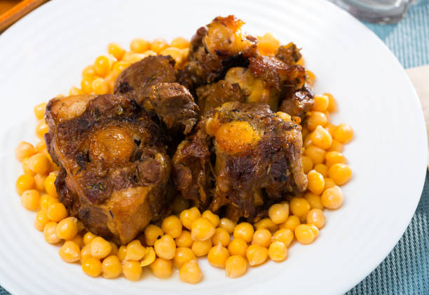 istock Braised oxtails with chickpeas on a white plate 1150913092