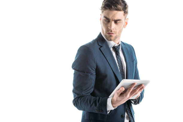 istock serious, thoughtful businessman using digital tablet isolated on white 1150913347