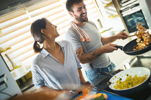 istock Young couple cooking at home. 1150914777