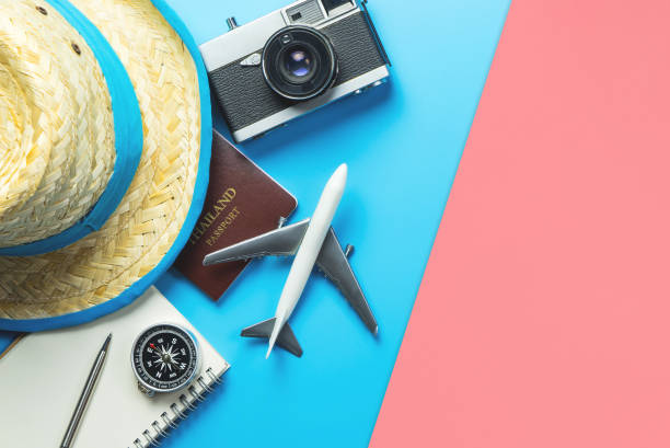 istock Travel accessories objects and gadgets top view flatlay on blue yellow pink 1150916407