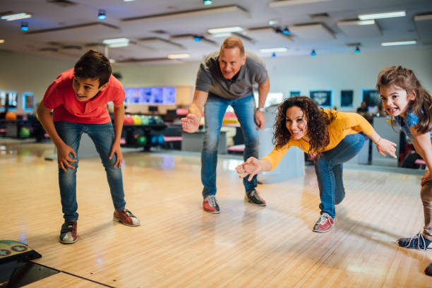 istock Family at the bowling alley 1150917886