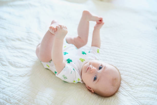 istock Cute baby girl lying on her back 1150917927