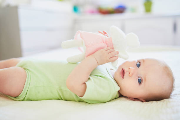 istock Cute baby girl lying on her back 1150917977