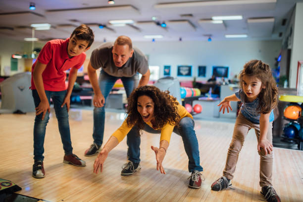 istock Joyful family bowling together 1150918020