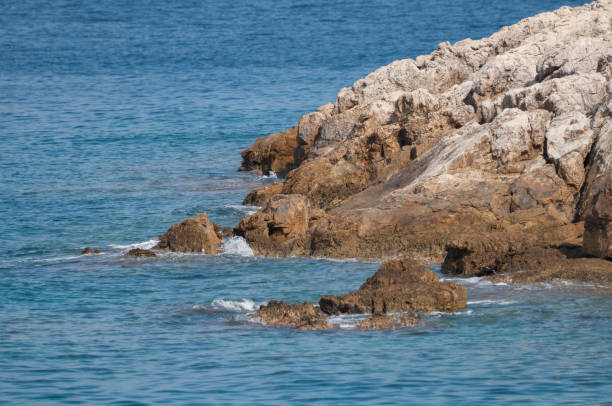 istock island's rocks delicately touched by the water 1150919984