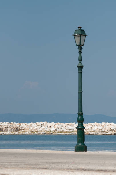 istock lighting pole in a port with a pier 1150920023