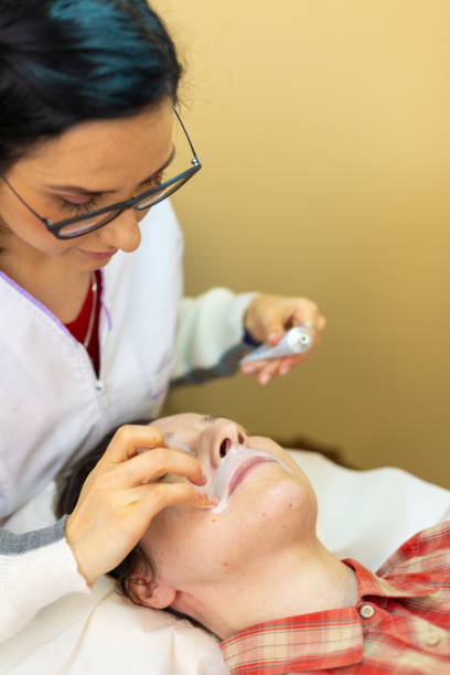 istock Cosmetic applying cream after mustache waxing 1150920236