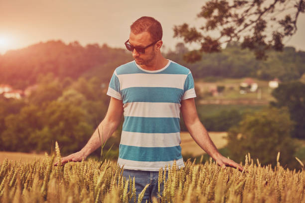 istock Man enjoying in wheat field. Nature concept. 1150920626