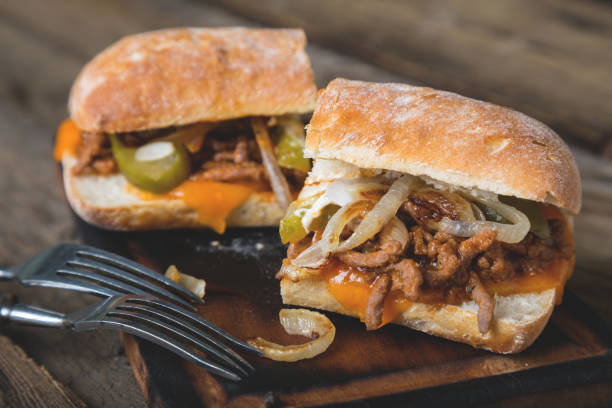 istock Big sandwich with meat, onions and cheddar cheese 1150922777