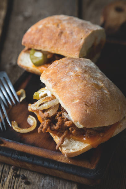 istock Big sandwich with meat, onions and cheddar cheese 1150922832