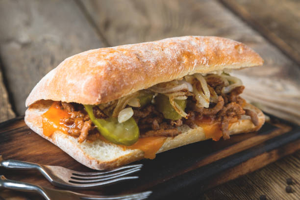 istock Big sandwich with meat, onions and cheddar cheese 1150922893
