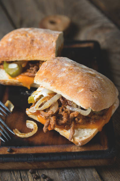 istock Big sandwich with meat, onions and cheddar cheese 1150922952
