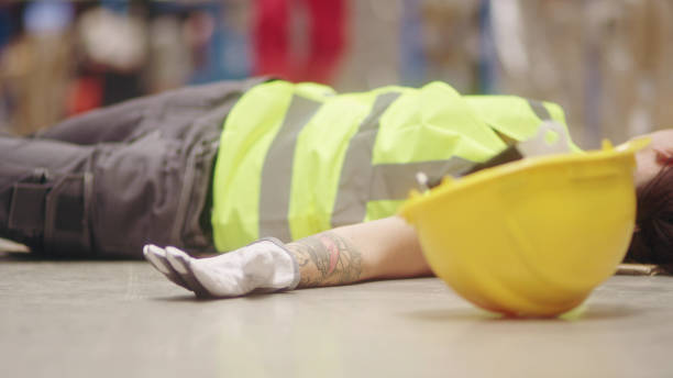 istock Dangerous accident during work. Unconscious woman 1150924790