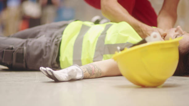istock Dangerous accident during work. Unconscious woman 1150924843