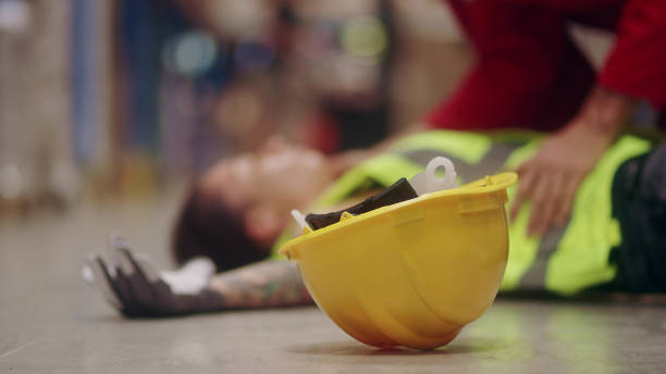 istock Dangerous accident during work. Unconscious woman 1150924923