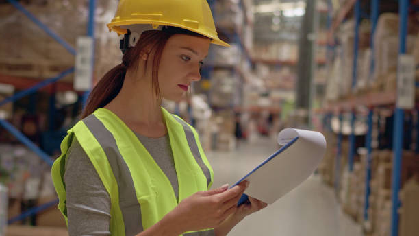 istock Woman working at a warehouse. Counting stocks 1150925009