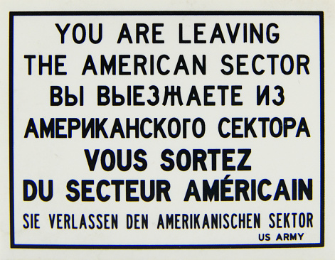 Warning sign plate, You are leaving the American sector in English, Russian, French and German languages