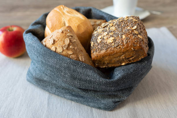 A basket full of bread rolls for breakfast stock photo