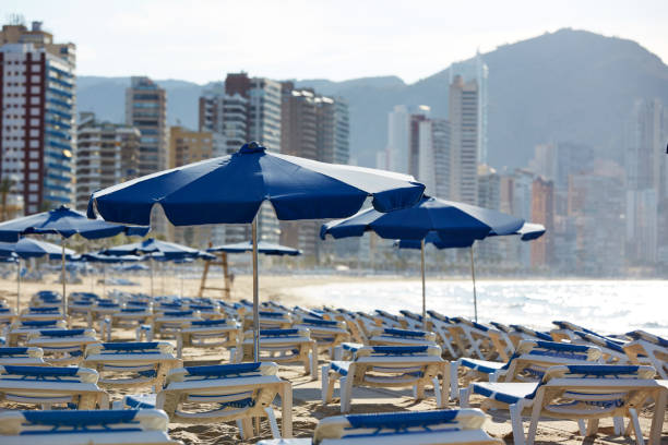 istock Benidorm sunrise with hammocks and parasol 1150928300