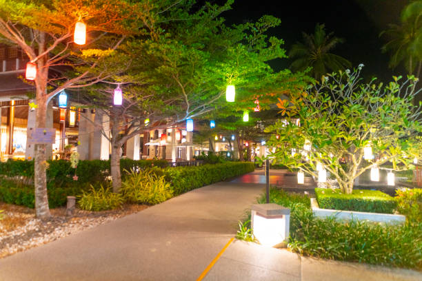 Pakarang Beach, Thailand. Ornamental gardens at night in the grounds of the Apsara Beach Villa Resort on Pakarang Beach.