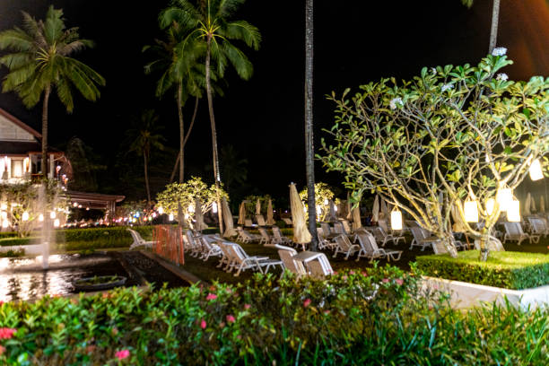 Pakarang Beach, Thailand. Ornamental gardens at night in the grounds of the Apsara Beach Villa Resort on Pakarang Beach.
