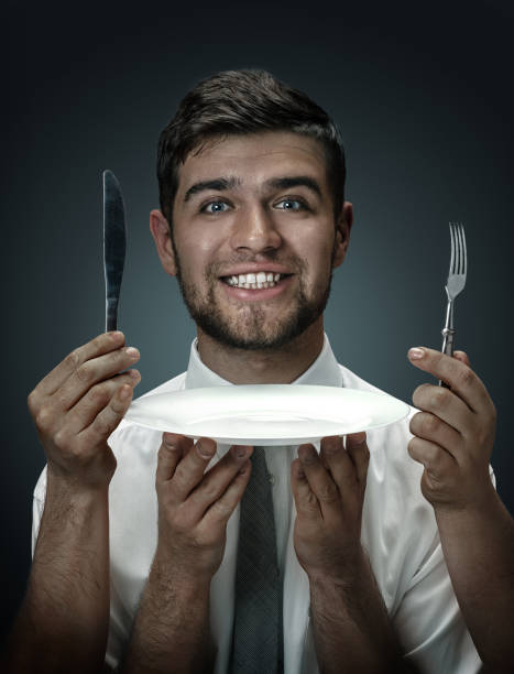 istock A young man surrounded by hands like his own thoughts 1150929744