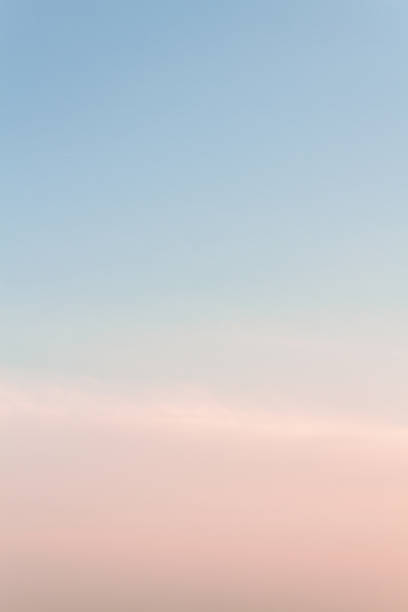 istock Beautiful sunset sky with feathery pink clouds in spring 1150931153