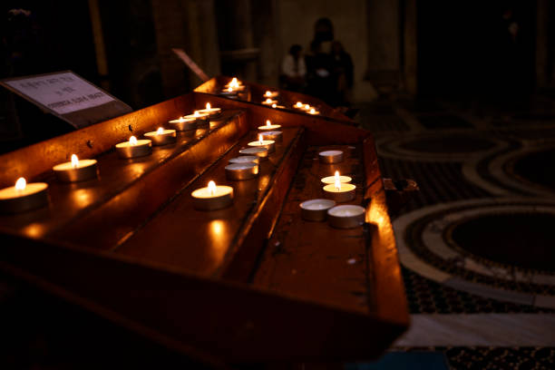 istock candles inside the church 1150931654