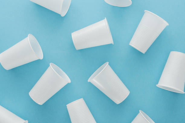 istock top view of white and plastic cups on blue background 1150933698