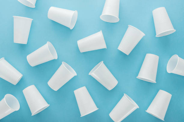 istock top view of white and plastic cups on blue background 1150933699