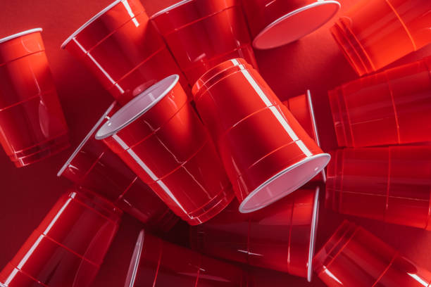 istock top view of bright and colorful plastic cups on red background 1150933760