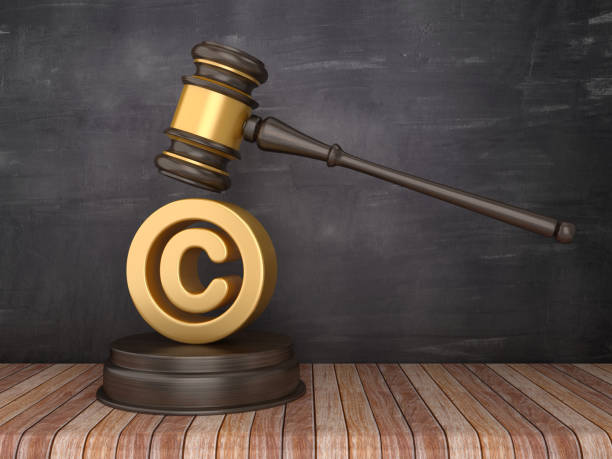 Gavel with Copyright Symbol on Chalkboard Background - 3D Rendering stock photo