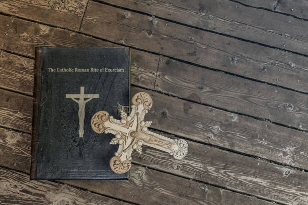 istock exorcism book on wooden floor 1150934736