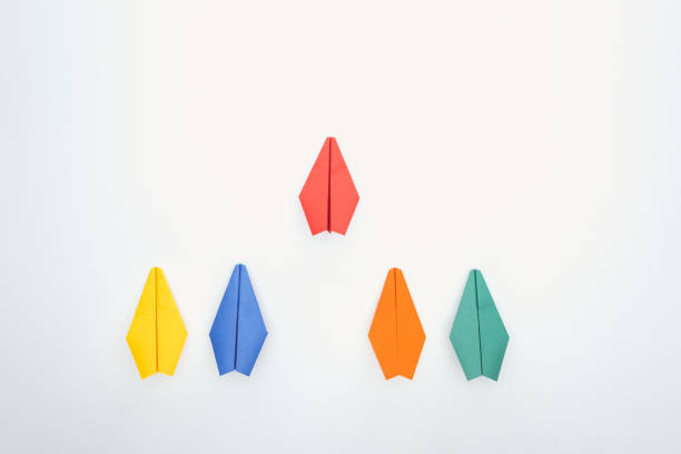 istock Flat lay with colorful paper planes on white surface 1150934797
