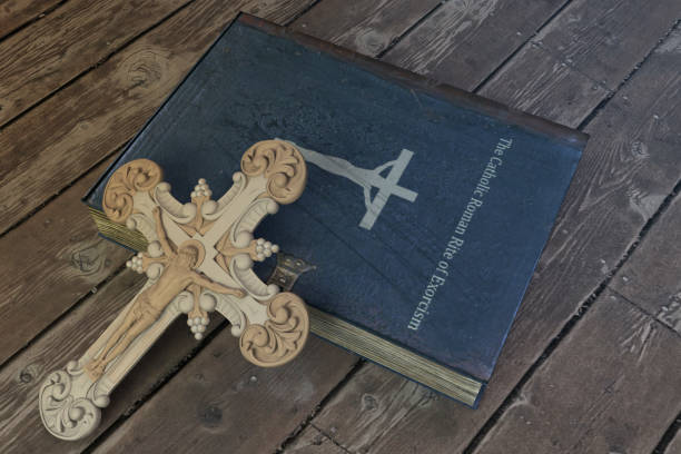 istock exorcism book on wooden floor 1150934886
