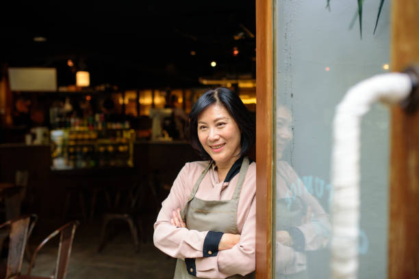 istock Senior Cafe owner standing with crossed arms 1150934965