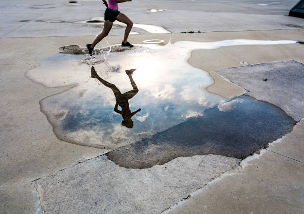 istock Woman Running on Asphalt 1150935017